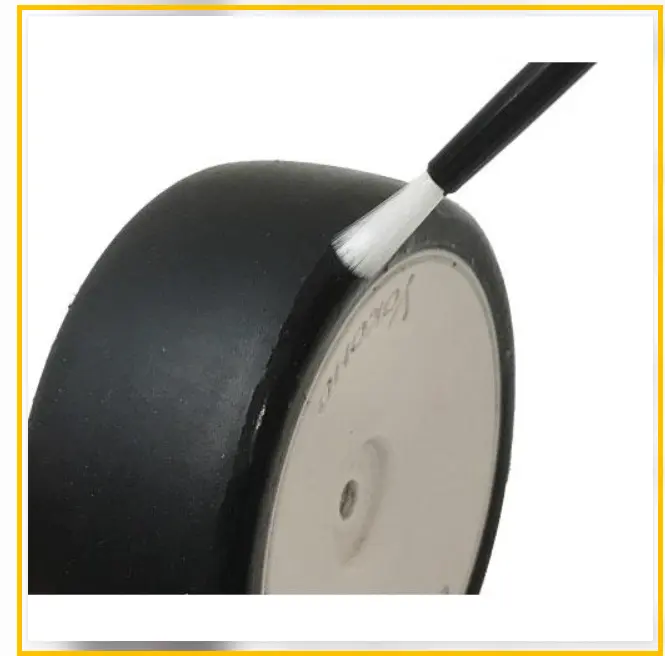Applying a thin layer of CA glue to the outer sidewall of an RC touring car front tire