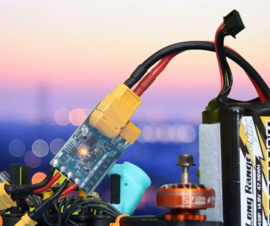 Electronic smoke stopper connected between an FPV drone battery and the drone power input