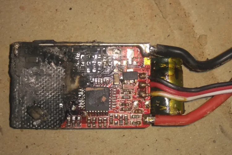 FPV drone ESC circuit board showing visible heat damage near a power component