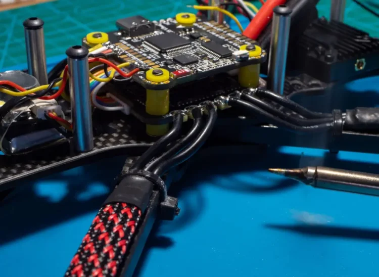 FPV drone flight controller and ESC wiring for checking motor output mapping
