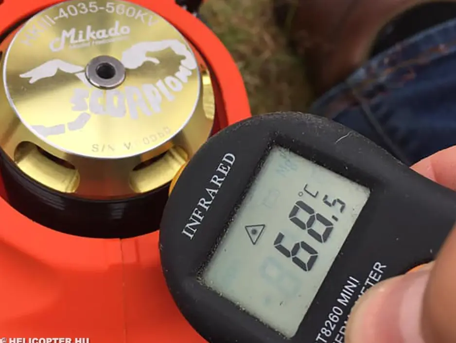 Measuring the temperature of an FPV drone motor with an infrared thermometer.