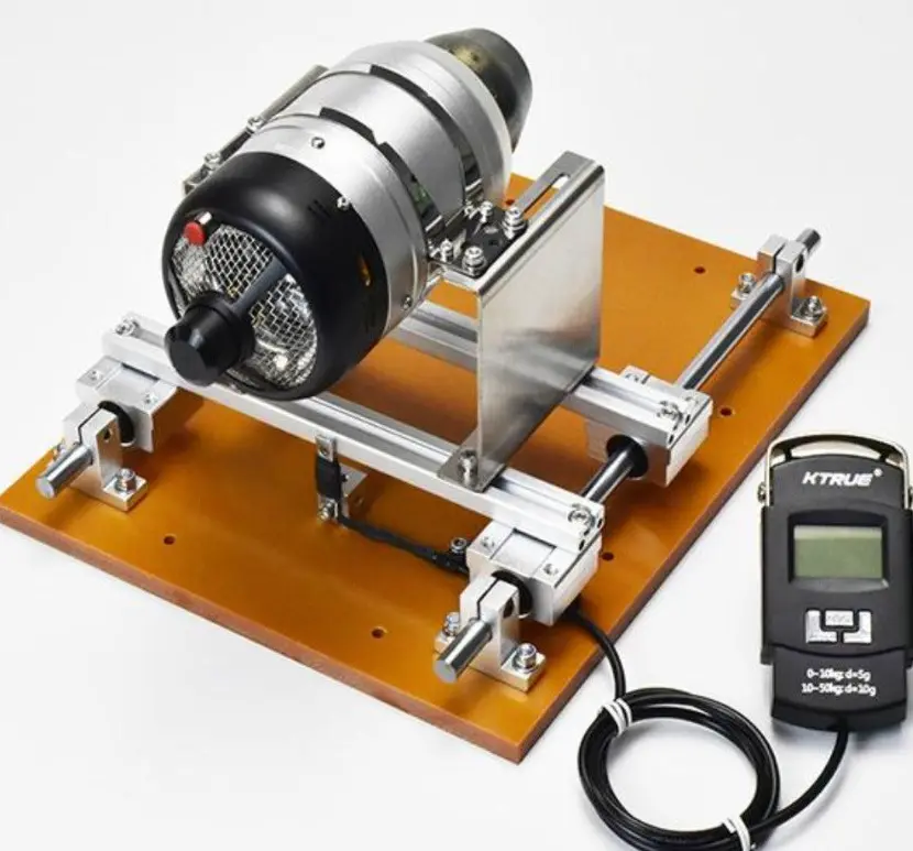 Micro turbine engine mounted on a test stand for thrust measurement