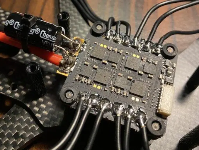One Drone Motor Getting Hot - Close-up of motor wires soldered to an FPV drone ESC