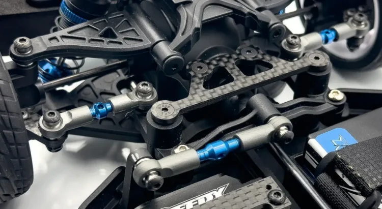 RC car front suspension showing turnbuckles and suspension arms