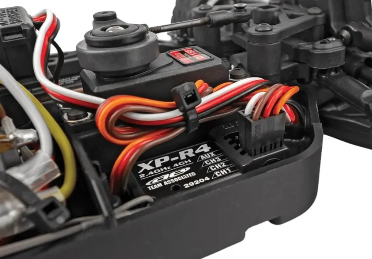 RC car receiver and motor wiring positioned inside the chassis