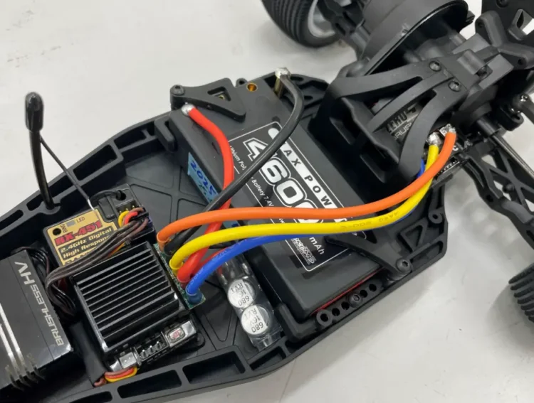 RC car receiver, battery pack, ESC, and wiring inside the chassis