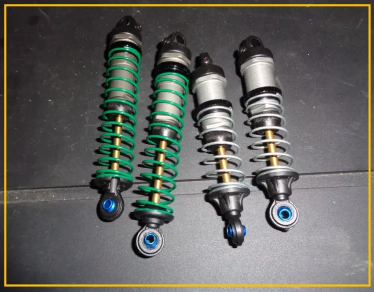 RC car shock absorbers with spring preload collars side by side