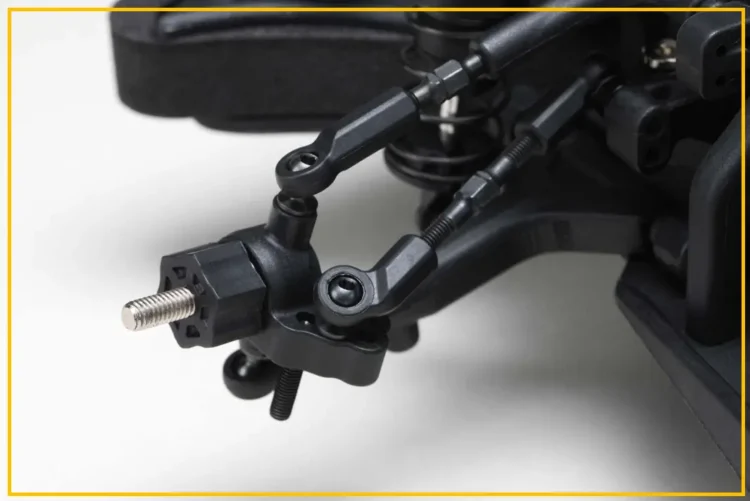 RC car steering linkage showing ball ends and steering knuckles