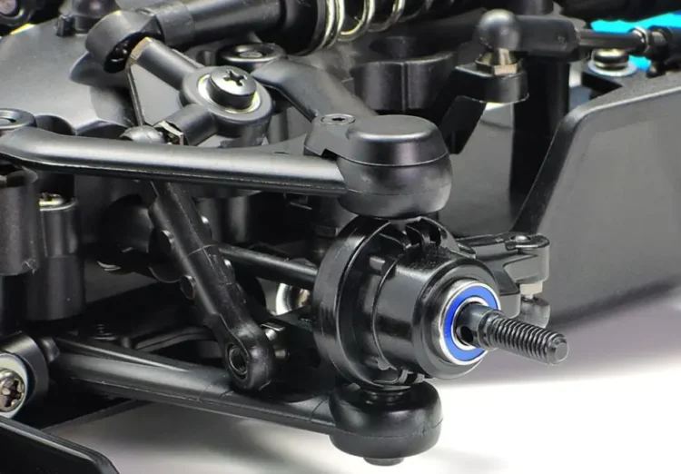 RC car wheel hub bearing and driveshaft during inspection