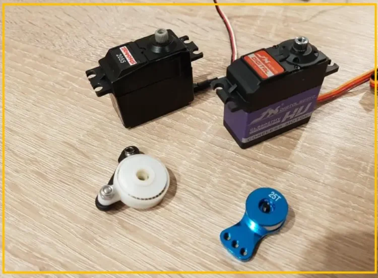 RC servo motor with its output shaft and servo horn visible