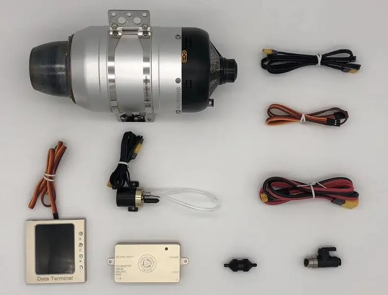 RC turbine engine control unit, handheld data terminal, and fuel pump on a workbench